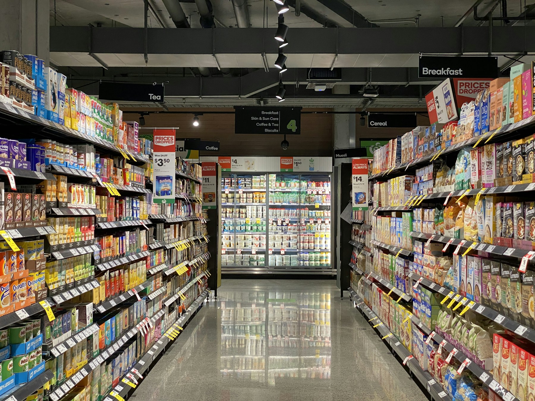 A fully stocked supermarket aisle representing AI shelf monitoring and product detection