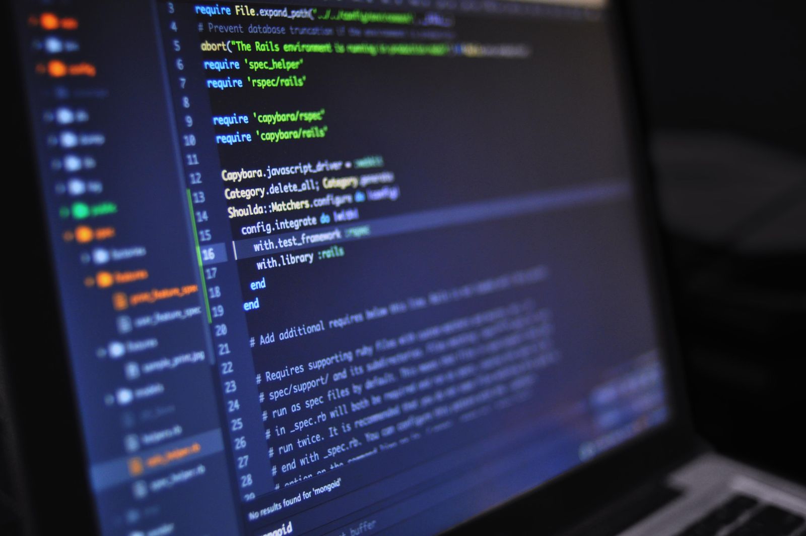 Software engineering workspace with code on screen